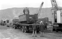 Unloading a former Highland Railway locomotive tender at Aviemore, Strathspey Railway, on 15 October 1978. It had been unearthed during redevelopment of the old locomotive depot site at Inverness. The relic was subsequently scrapped.<br><br>[Bill Roberton 15/10/1978]