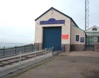 With the Isle of Anglesey visible in the background this is the tramway's Summit station at Great Orme. Everything is <I>battened down</I> for winter at this exposed location with one of the two upper section tramcars inside the shed and all the haulage cables removed. The line celebrated its centenary in 2002 and will reopen for the summer season in late March 2012.<br><br>[Mark Bartlett 30/11/2011]