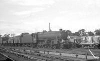 The northern approach to Beattock station in July 1962. Motherwell Black 5 no 45085, with less than 6 months operational life remaining before withdrawal, is about to take an up freight through the station. <br><br>[R Sillitto/A Renfrew Collection (Courtesy Bruce McCartney) 14/07/1962]