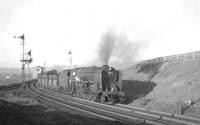 BR Standard class 9F 2-10-0 no 92064 with a load of iron ore from Tyne Dock passing Annfield East signal box on the climb up to Consett in April 1965. Helping out at the rear of the train are two class 37 diesel locomotives. <br><br>[K A Gray 10/04/1965]