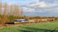 Hanson liveried 59101 standing on the westbound loop at Challow with a freight on 15 December 2011. The former station at Challow, on the GW main line 12 miles west of Didcot, closed to passengers in December 1964.<br><br>[Peter Todd 15/12/2011]