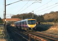 In a low winter sun on 24 January 2009, a First TransPennine Express service to Mancester Airport heads south on the WCML at Woodacre.<br><br>[John McIntyre 24/01/2009]