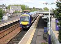 An afternoon service to Edinburgh Waverley about to leave the southbound platform of a particularly neat and tidy Cowdenbeath station in May 2005.<br><br>[John Furnevel 04/05/2005]