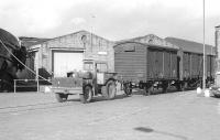 After the demise of the small 0-4-0 diesels which used to shunt Leith Docks, a Muir Hill tractor was used to move traffic to the new Chancelot Mill from Leith South yard. Photographed here in September 1978.<br><br>[Bill Roberton /09/1978]