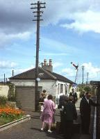 Platform view at St Monance station in the East Neuk of Fife as passengers leave an eastbound train. The photograph was taken a short time before station closure in September 1965 along with withdrawal of passenger services along the coast between Leven and St Andrews. [See image 17857]<br><br>[Frank Spaven Collection (Courtesy David Spaven) //1965]
