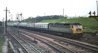 The 09.40 Perth - Kensington Olympia Motorail train approaches Carstairs behind Brush Type 4 No. 1743 on Saturday 23 May 1970. As far as can be seen it is only conveying two cars, so the occupants will hardly be complaining of overcrowding!<br><br>[Bill Jamieson 23/05/1970]