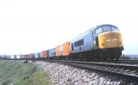 A <I>Peak</I> with a Harwich - Birmingham Freightliner service photographed near Manningtree in 1988.<br><br>[Ian Dinmore //1988]