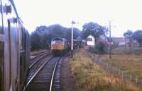 In October 1972, the daily freight to the Far North waits in Forsinard loop for a southbound passenger train heading for Inverness. Forsinard north box stands in the background. <br><br>[Frank Spaven Collection (Courtesy David Spaven) /10/1972]