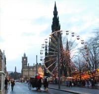 A seasonal alternative to the tram turns at the ferris wheel on Princes Street and makes its way back to the west end. <br><br>[Ewan Crawford 24/12/2011]