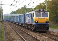 92017 in the livery of a well known transport operator hauling containers of a well known supermarket heading north on 6 May 2011 approaching Balshaw Lane Junction.<br><br>[John McIntyre 06/05/2011]