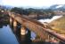 A tranquil sunlit summer's evening in Carmarthen in 1971. This graceful bridge over the River Tywi carried the freight branch to Lampeter and Felin Fach, which closed two years later. [See image 38211]<br><br>[David Spaven //1971]