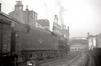 Black 5 no 45457 off Ardrossan shed waits patiently at Princes Street level crossing with a freight ready to leave the port area in December 1962. Ardrossan Town station stands on the other side of the crossing.<br><br>[R Sillitto/A Renfrew Collection (Courtesy Bruce McCartney) 29/12/1962]