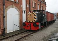 D2868, a Class 02 Yorkshire Engine Co. 0-4-0DH, arrived at Manchester Museum of Science and Industry in early 2011, along with Barclay 06003. The 02 was an appropriate exhibit as this class replaced the L&YR <I>Pugs</I> in the Manchester and Salford goods yards. It is seen here, outside one of the old warehouses, from a passing internal steam train service. D2868 itself was a Lostock Hall loco, [See image 25579] being withdrawn from there in December 1969 and passing into industry and then preservation. It was moved away from MOSI to Peak Rail, Derbyshire in early 2013.<br><br>[Mark Bartlett 30/12/2011]