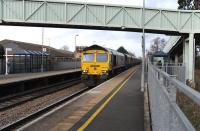 Freightliner 66585 brings southbound coal empties through Ashchurch station in December 2011.<br><br>[Peter Todd 29/12/2011]