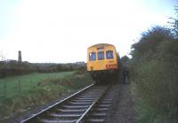 The Lea Valley Railway Club <I>'Royal Duchy'</I> railtour visiting the china clay sidings at Meledor Mill, Cornwall, on 30 April 1977. The DMU is preparing to leave on the next leg of the tour to Newquay via St Dennis Junction.<br><br>[Ian Dinmore 30/04/1977]