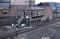 The signal box at Whifflet East Junction, as viewed from Whifflet Street bridge on 7 March 1971, with the RB Tennent works in the background. It appears to have been replaced by a ground frame on the opening of Motherwell Power Box.<br><br>[Bill Jamieson 07/03/1971]
