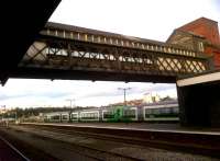The footbridge between the lifts at Shrub Hill has seen better days - notice the additional ventilation along the South side! Notice also, the squeaky clean new class 172's in the sidings.<br><br>[Ken Strachan 31/12/2011]
