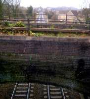 This location, East of Oldfield Park station, is where the S&D crossed the Great Western. Their physical position may have been superior, but their financial position was worse. Happily, the S&D bridge has recently had some very neat maintenance done. View east on New Year's Day 2012.<br><br>[Ken Strachan 01/01/2012]