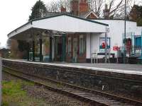 Criccieth station still retains a restored ornate canopy, complete with period style electric lighting, running along the front of the station building. The building itself is now owned by a televison repair business, although the canopy is still railway owned. <br><br>[David Pesterfield 08/12/2011]