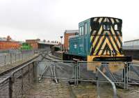 View from the Manchester Museum of Science and Industry yard along the running line towards the original Liverpool Road station building. In the foreground is sole surviving Barclay Class 06 0-4-0DM 06003 (resident here from 2011 to 2013) with a centre cab electric shunting locomotive in the middle distance.<br><br>[Mark Bartlett 30/12/2011]