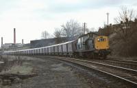 The LGW block grain train from Leith to Gorgie is pictured on Friday 17 April 1970 negotiating the sinuous section of the Sub between Newington and Blackford Hill on the approach to the latter. Motive power is the customary Clayton, in this case No. D8583.<br><br>[Bill Jamieson 17/04/1970]