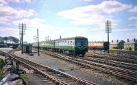 A Swindon InterCity DMU passes Saughton Junction in August 1957 with a Glasgow Queen Street - Edinburgh Waverley shuttle service. Note the goods yard (left) and carriage sidings (right) are still in use.<br><br>[A Snapper (Courtesy Bruce McCartney) 01/08/1957]