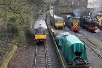 Morning shed scene at Haworth. As railbus M79964 trundles past on the first train of the day for Keighley locos are being prepared in the yard.  Sole surviving Hudswell Clark 0-6-0DM D2511 is just about to leave with a works train while 4F 0-6-0 43924 is raising steam for later passenger duties.<br><br>[Mark Bartlett 07/01/2012]