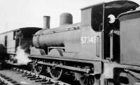 Tales of Old Fairlie Pier. A photograph taken many years ago by a young man on an outing at Fairlie Pier. A 4F had broken down at the pier station and Caley Jumbo 57348 had been sent from Ardrossan shed to assist, with men soon clambering around under the 4F's boiler among the motion. Photographed with a box camera on 13 April 1962.<br><br>[Colin Miller 13/04/1962]