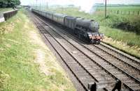 During 1957/58 the morning <I>Talisman</I> was extended to Perth and re-dubbed <I>The Fair Maid</I>. The train is seen here shortly after passing through Drem on 30 June 1958 with A3 Pacific no 60098 <I>'Spion Kop'</I> in charge sporting the new headboard above the buffer beam.<br><br>[A Snapper (Courtesy Bruce McCartney) 30/06/1958]