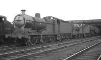 Fowler 4F no 44390 is one of a number of locomotives standing in the shed yard at Workington on Saturday 22 September 1962.<br><br>[K A Gray 22/09/1962]