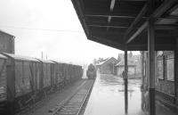 A branch train from Dumfries arriving through the rain at Kirkcudbright in March 1963, just over two years prior to closure of the line.<br><br>[R Sillitto/A Renfrew Collection (Courtesy Bruce McCartney) 09/03/1963]