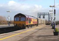 DBS 66112 Oxford bound through Platform 3 of Didcot Station on 5 January with a rake of car transporter empties.<br><br>[Peter Todd 05/01/2012]