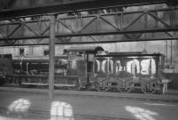 Following closure of Hellifield shed by BR in 1963 it was subsequently used for the storage and renovation of exhibits earmarked for the National Railway Museum in York, which opened in 1975. This photograph, taken inside Hellifield shed (thought to have been on 13 February 1965), shows Holden 0-6-0 no 1217, now part of the national collection. Built at Stratford in 1905 as GER class G58 no 1217 and finally withdrawn from 31B March in 1962 as BR class J17 no 65567, the preserved locomotive is currently on extended loan to Barrow Hill Railway Centre.<br><br>[Robin Barbour Collection (Courtesy Bruce McCartney) 13/02/1965]