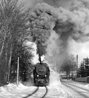 It's surely not a particularly steep climb away from the station there? The 09.42 Wernigerode Westerntor - Nordhausen train photographed on 23rd February 1987 - apparently working hard.<br><br>[Bill Jamieson 23/02/1987]