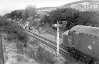 37004 at the south end of Dalwhinnie loop in April 1978, with workers preparing the trackbed for relaying the second track.<br><br>[Bill Roberton /04/1978]