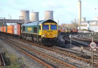 Freightliner 66567 heading east after restarting its train following a long wait in the loop at Didcot on 5 January 2012.<br><br>[Peter Todd 05/01/2012]