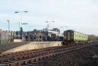 The green livery of a cascaded former Centro Sprinter makes a change from the usual Northern purple at Morecambe. The cars that make up set 150206 actually ran for many years as centre coaches in two three-car units in the West Midlands but were reunited when sent to Northern, who have indicated they will be rebranding their <I>new</I> stock quickly. On this day 150206 was heading for Leeds while 153352 was for Lancaster.<br><br>[Mark Bartlett 13/01/2012]