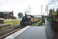 During 1957/58 no 40186 spent around 9 months at St Margarets on what appears to have been an extended loan from Dawsholm shed. The ex-LMS 2-6-2T is seen here approaching Joppa station on 23 August 1957 heading west, with our local commuter still observing events from behind the fence [see image 37154]. I wonder if he ever made it to work on that particular Friday....<br><br>[A Snapper (Courtesy Bruce McCartney) 23/08/1957]