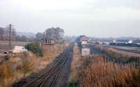 An October 1974 view of the old signal box and extensive goods yard at Brechin. At the time - 6� years before closure - the Kinnaber Junction to Brechin branch was handling a variety of agricultural and coal traffic, plus - as seen in this photograph - pipes for the North Sea oil sector. The pipe traffic was later switched to Laurencekirk [see image 12553], then Dyce, while the Brechin to Bridge of Dun line gained a new lease of life as the preserved Caledonian Railway.<br><br>[Frank Spaven Collection (Courtesy David Spaven) /10/1974]