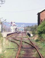 Looking back through the station platforms at Battersby, North Yorkshire, from the buffer stops in the spring of 1987. View is north east towards the junction of the Middlesbrough and Whitby routes, with the North York Moors forming the horizon. <br><br>[Ian Dinmore 08/05/1987]