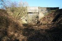 The overgrown trackbed shortly after leaving Roslin station looking towards Loanhead in February 2011, approximately 45 years after this section of the line was closed. The old overbridge seen here is still in use [see image 33195].<br><br>[John Furnevel 28/02/2011]