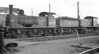 Scene in the yard at Stratford, thought to have been photographed around 1960, with part of the shed's unique high-capacity coaling plant visible in the left background.  The two locomotives featured are Holden GE Class J15 0-6-0 no 65476 and Drewry 0-6-0DM no 11134. <br><br>[K A Gray //1960]