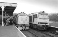 At a gloomy Dunfermline Lower (now Town) 37201 waits to be named Saint Margaret while 60066 passes with a coal train on 16 November 1993. 37201 was scrapped at Booths, Rotherham, in March 2009.<br><br>[Bill Roberton 16/11/1993]