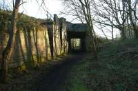 To avoid conflicting movements across the west coast main line, a burrowing junction was created at Standish to the north of Wigan to cater for the route from Whelley Junction. Although the secondary route disappeared in the 1970s the structure remains intact. View south on 15 January 2012.<br><br>[John McIntyre 15/01/2012]