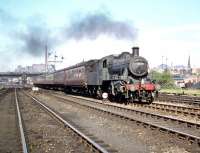 St Margarets Ivatt class 2MT 2-6-0 no 46462 trundles west with a train past Haymarket shed on 4 July 1959, probably heading for carriage sidings at Saughton Junction. The locomotive had been allocated to 64A from new in June 1950. <br><br>[A Snapper (Courtesy Bruce McCartney) 04/07/1959]