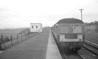 A DMU stands at the platform at Heads of Ayr station in May 1963. The original Heads of Ayr station, located slightly west of here, had closed in 1930 and the second station was opened in 1947 to serve the holiday camp opened nearby after WWII. This station finally closed in September 1968, along with the remainder of the line back to Alloway Junction. <br><br>[R Sillitto/A Renfrew Collection (Courtesy Bruce McCartney) 25/05/1963]