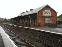 View west at Porthmadog station on 8 December 2011. The building now houses the <I>'Station Inn'</I> pub and cafe.<br><br>[David Pesterfield 08/12/2011]
