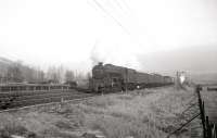 Ardrossan shed's Black 5 no 45463 heading back from Largs with the daily branch goods in December 1962 about to run through West Kilbride station. <br><br>[R Sillitto/A Renfrew Collection (Courtesy Bruce McCartney) /12/1962]