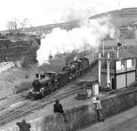 The pairing of LNWR Precedent class 2-4-0 No. 790 'Hardwicke' and the Midland Compound No. 1000 might not have been historically authentic but the two locos still made a pleasing sight as they passed Shipley Bingley Junction box in April 1976 while working the Gainsborough Model Railway Society's London & North Western & Midland Railways Joint Tour between York and Carnforth. The only jarring note is the BR corporate blue and grey livery adorning the Mk1 coaches which formed the train.<br><br>[Bill Jamieson 24/04/1976]