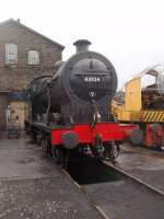 Early morning steam raising in the KWVR yard at Haworth sees Midland 4F 0-6-0 43924 over the inspection/ash pit on 7 January 2012. It sports an 82E Bristol Barrow Road shed plate, where it spent several years, but its final shed was Gloucester. This led to it ending up in Woodham's scrap yard at Barry and its main claim to fame is that it was the first locomotive to be rescued from there, over forty years ago. It has been a regular performer on the KWVR over many years and returned to service again in 2011 after another overhaul. [See image 32012] Picture by kind permission of KWVR staff.<br><br>[Mark Bartlett 07/01/2012]